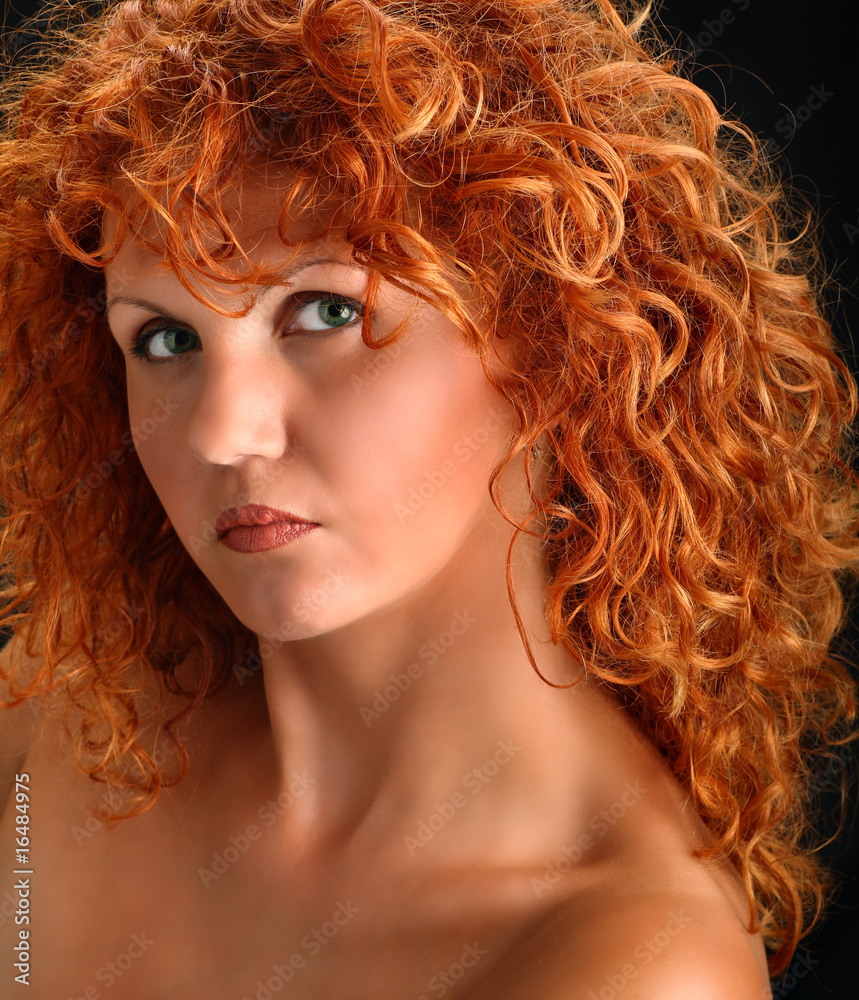 Portrait of beautiful redhead woman with rich curly hair Stock Photo ...