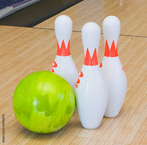 green bowling ball and pins
