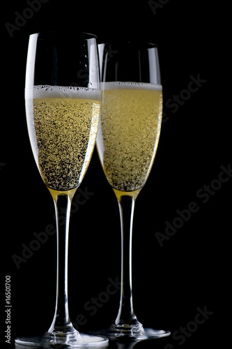 Two glasses champagne on black closeup