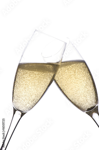 Two glasses champagne on white