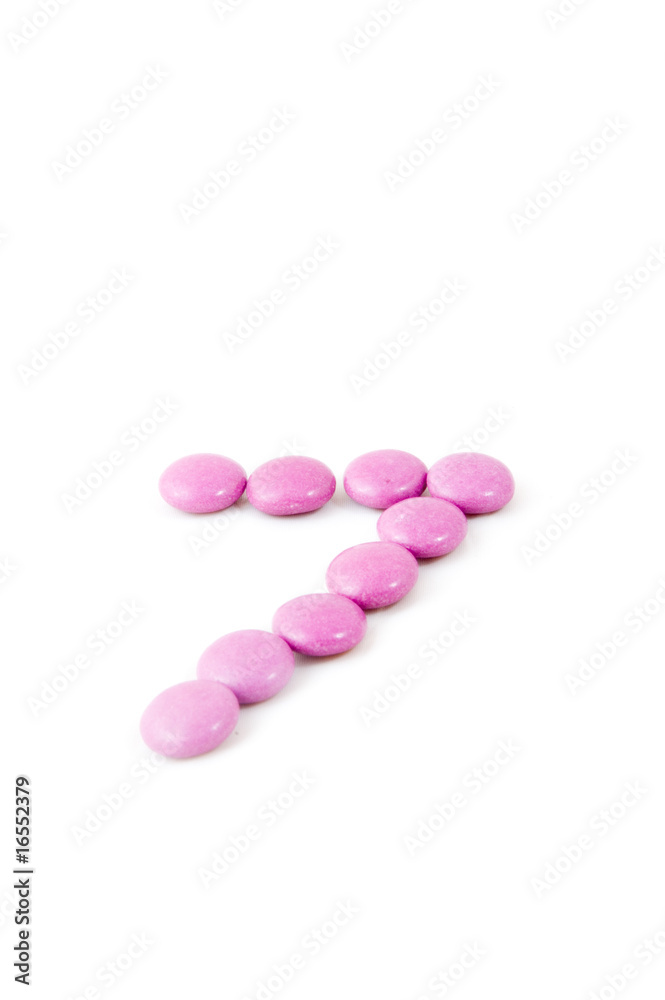 number seven made of candies isolated on white