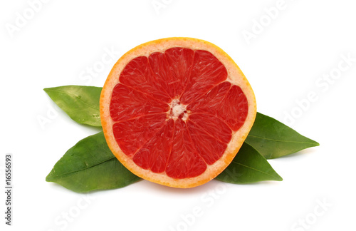 Grapefruit red with green leaves photo