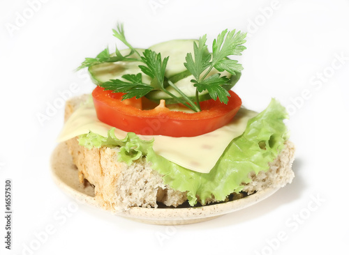 sandwich with cheese, sweet pepper, cucumber and parsley