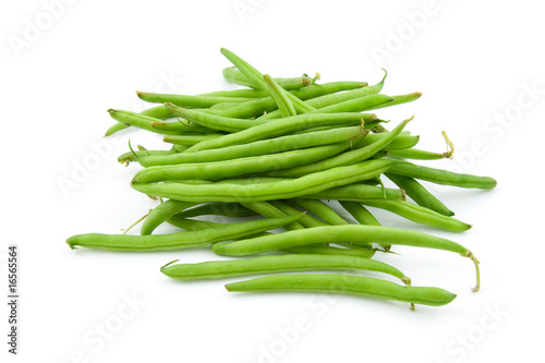 raw green beans over white background