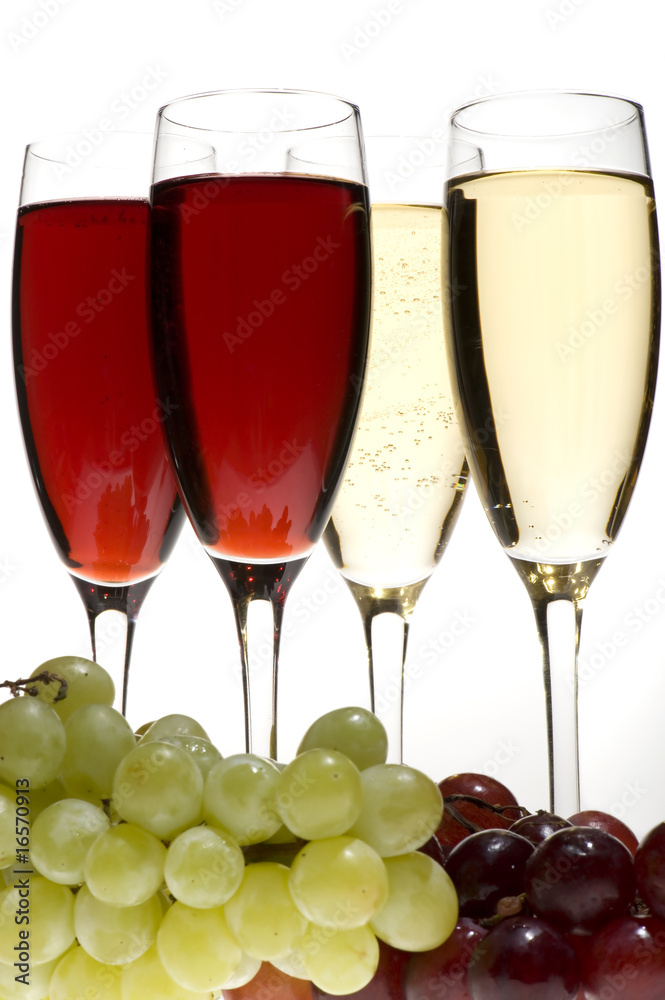 champagne glasses with grapes on grey closeup champagne glasses with grapes on grey closeup