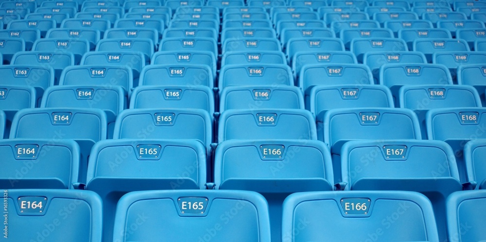Rows of Emtpy Seats in a Stadium Rows of Emtpy Seats in a Stadium