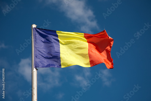 Romanian flag against blue sky