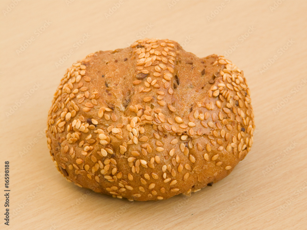 Sesame bun on the wooden background Sesame bun on the wooden background