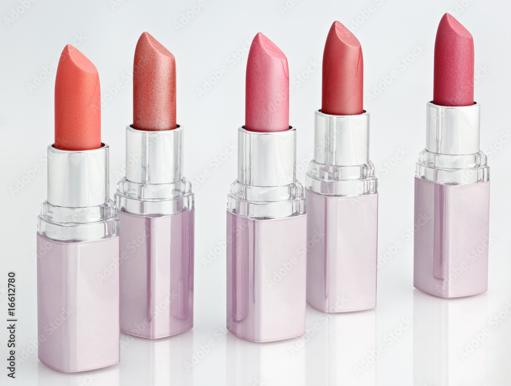 Color lipsticks arranged in line isolated on white Color lipsticks arranged in line isolated on white