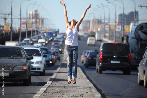 girl jumps on highway middle