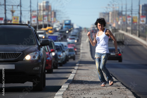 girl dances on highway middle © Pavel Losevsky