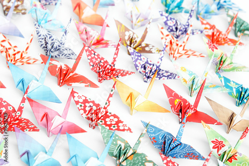 A group of origami cranes on a white background