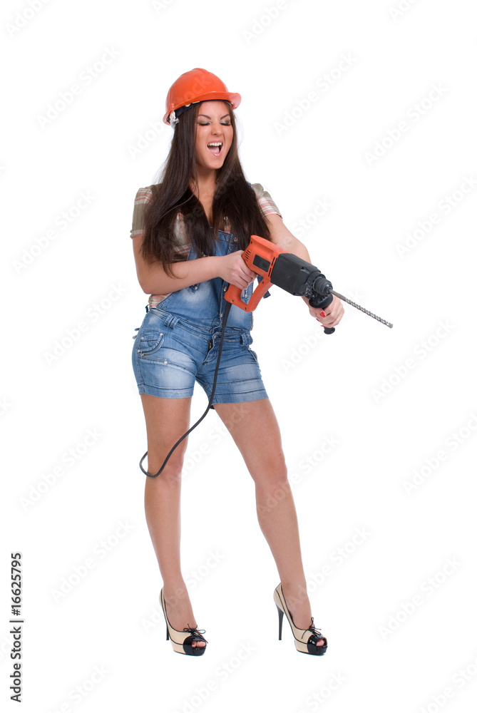 Young woman in orange helmet holding hammer drill Young woman in orange helmet holding hammer drill