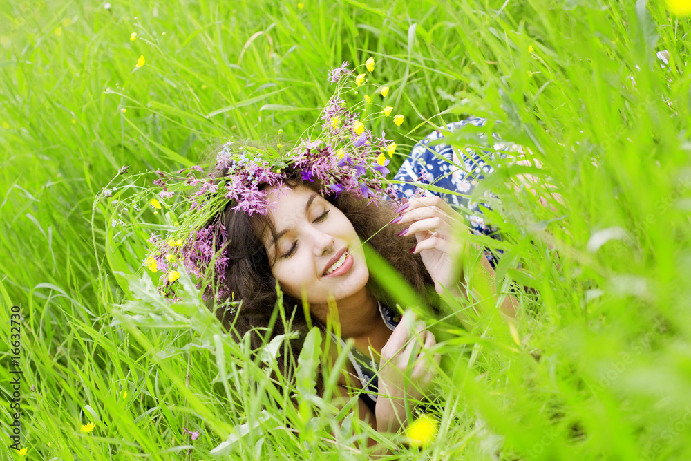 Girll, lying on the grass field Girll, lying on the grass field