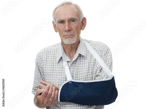 Senior man ith painful arm in sling