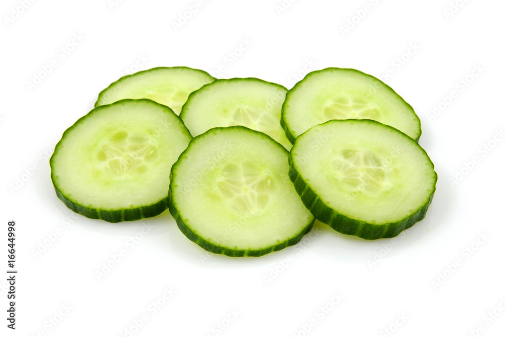 Six slices of fresh cucumber over white backgound Six slices of fresh cucumber over white backgound