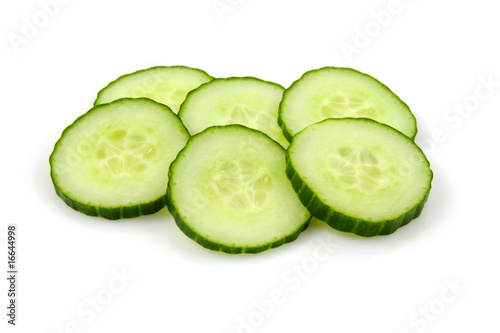 Six slices of fresh cucumber over white backgound