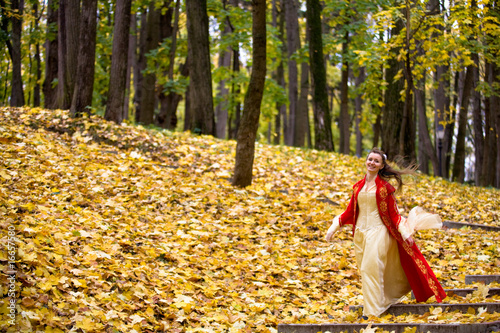 Lady in autumn forest