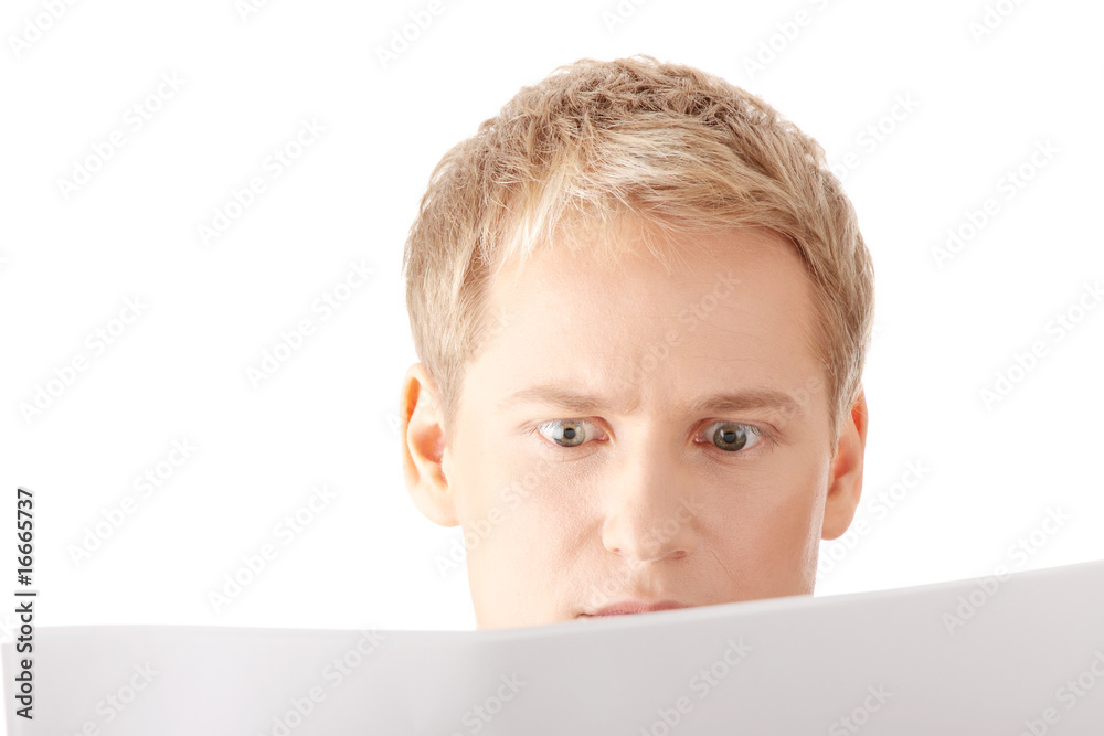 Successful young businessman reading blank card Successful young businessman reading blank card