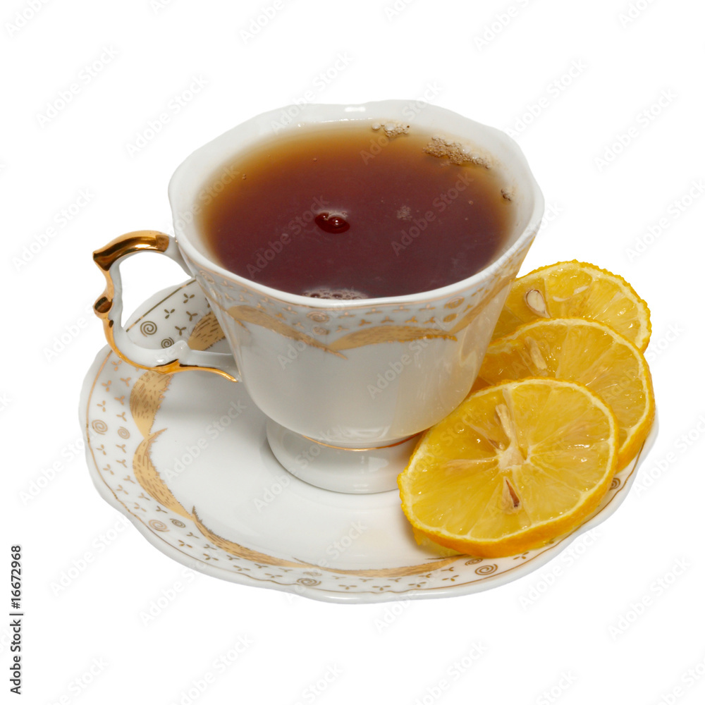 Teacup with tea and lemon isolated on white.