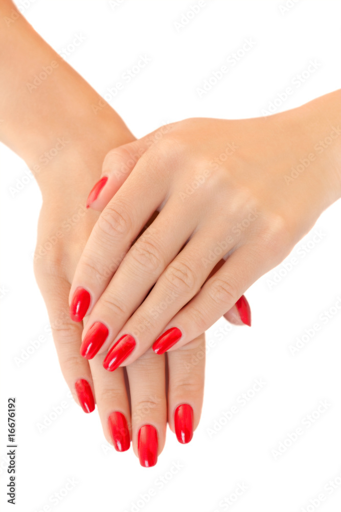 Hands of a young women.  Red nail polish