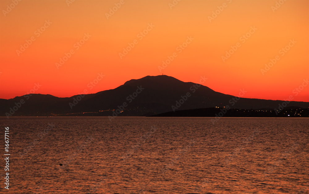 Hill and sea in Greece at sundown