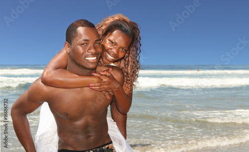 African American Couple Smiling on the Beach Outdoors