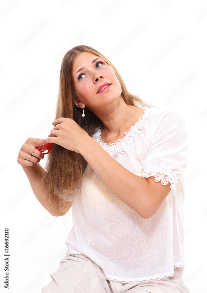 The girl in white clothes combs hair The girl in white clothes combs hair