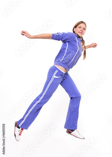 The girl in a dark blue sports uniform jumps