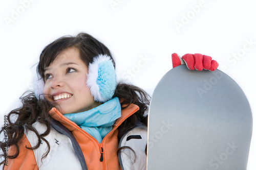 Laughing beautiful girl snowboarder