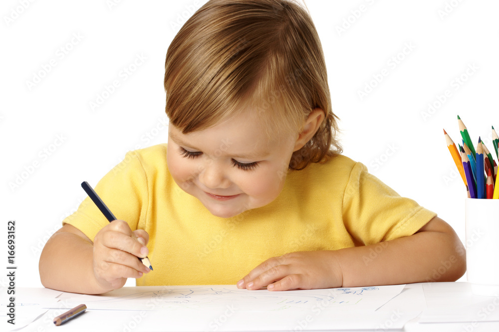 Playful child draw with crayons and smile Playful child draw with crayons and smile