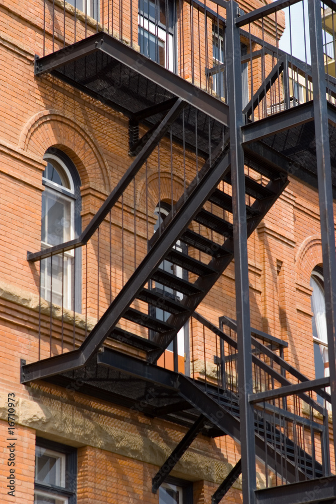 Fototapeta premium A fire escape on an old brick building
