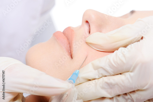 Close-up cosmetic injection in woman's cheek