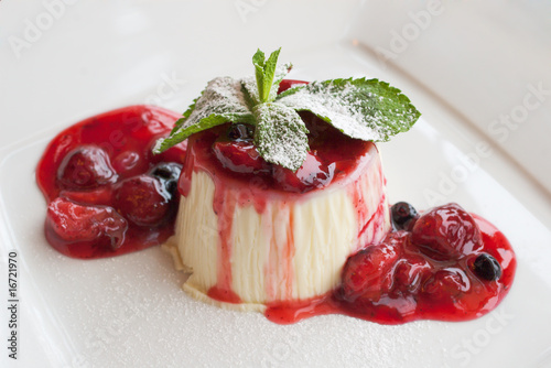 panna cotta dessert with wild berry sauce