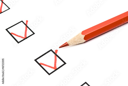 Red pencil and questionnaire