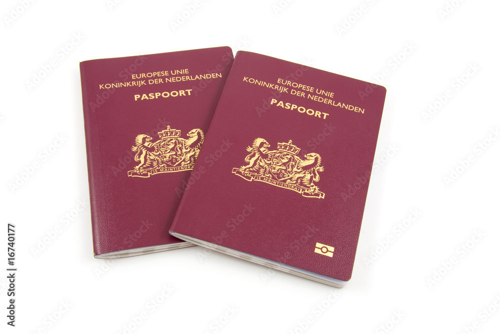 Two Dutch passport over white background Two Dutch passport over white background