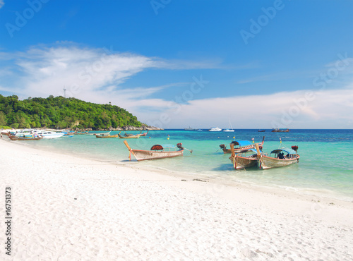 beach and sea with longtail boat on Koh Lipe, Thailand