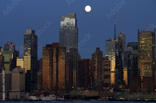 new york cityscape capture at night over hudson photo