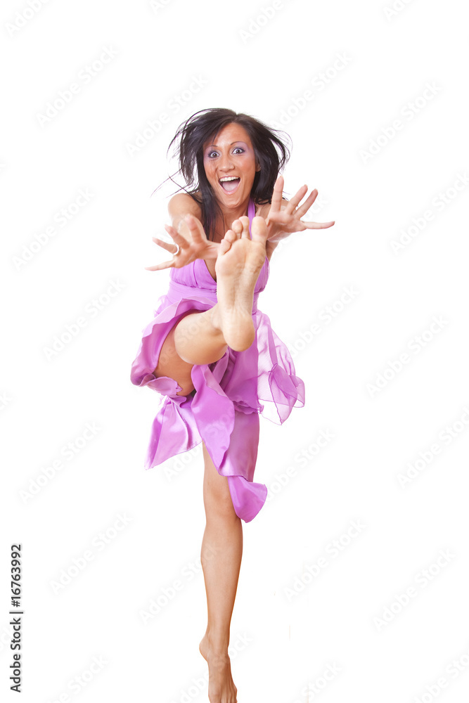 Smiling Woman In Violet Silk Dress Jumping Smiling Woman In Violet Silk Dress Jumping