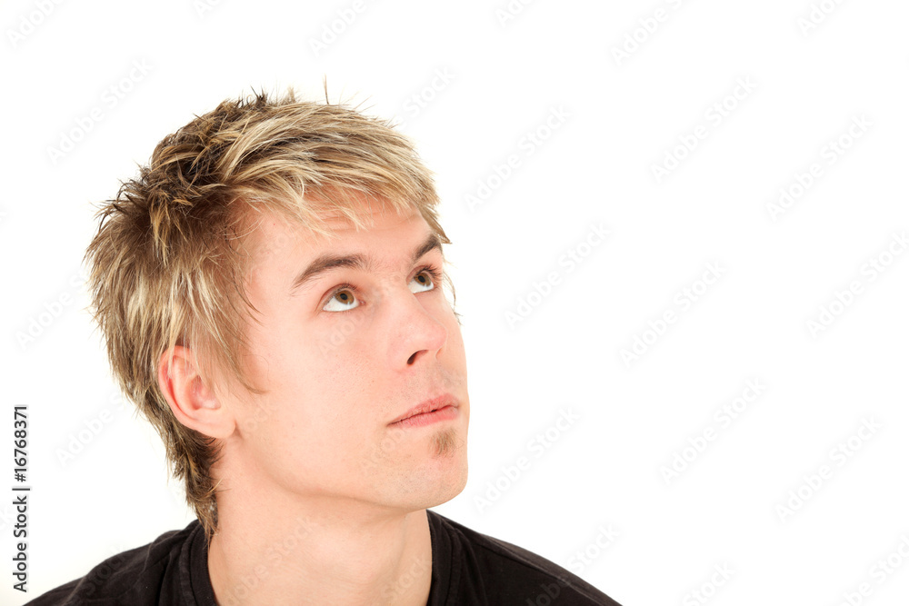 Portrait of teenage boy looking up, studio shot Portrait of teenage boy looking up, studio shot