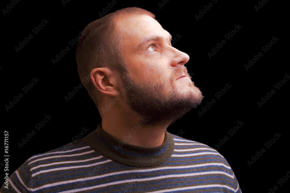 portrait of bearded male model look upward