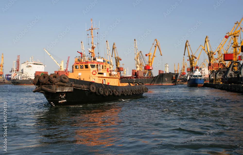Tow in harbour of sea trading port