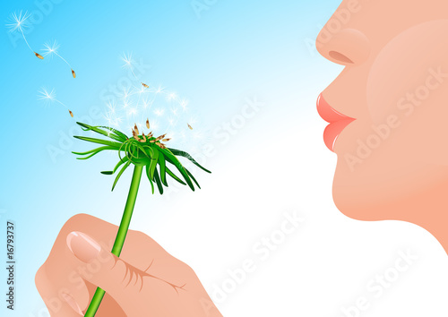 Girl blowing on dandelion