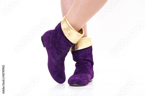 Female feet in violet boots photo