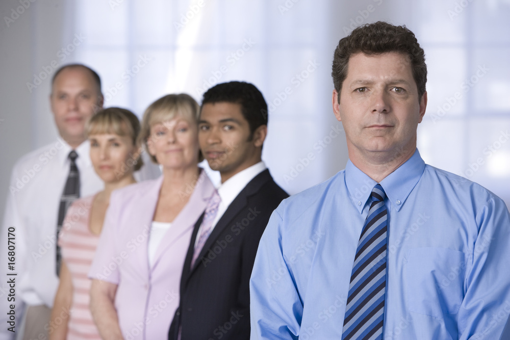 Portrait of businessman and his team. Portrait of businessman and his team.