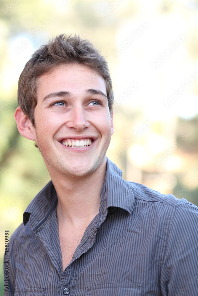 Outdoor portrait of a handsome young casual smiling man Outdoor portrait of a handsome young casual smiling man