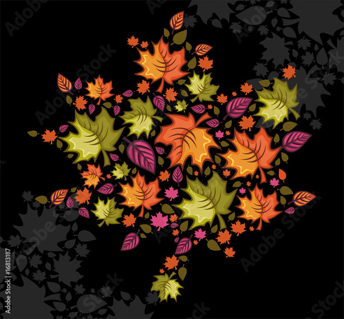 autumnal leafs combined in a shape of a heart.