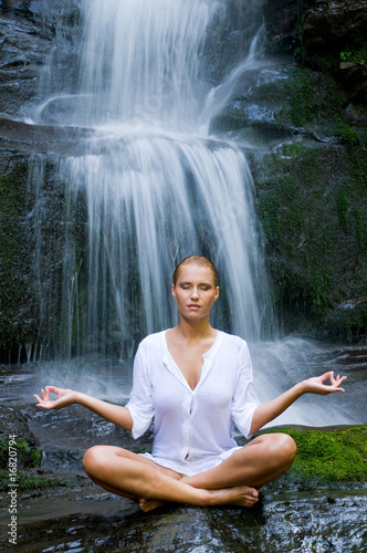Yoga meditation near waterfall