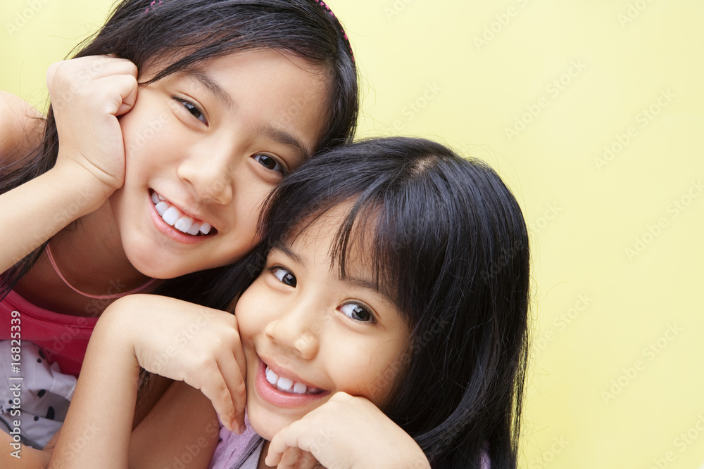 Two little girls posing to camera Two little girls posing to camera