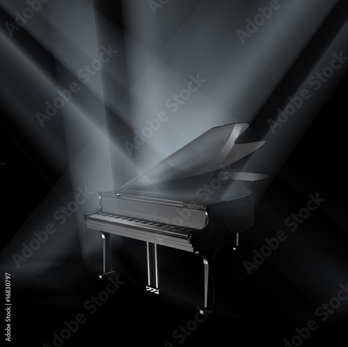 Piano on stage in spot lights.